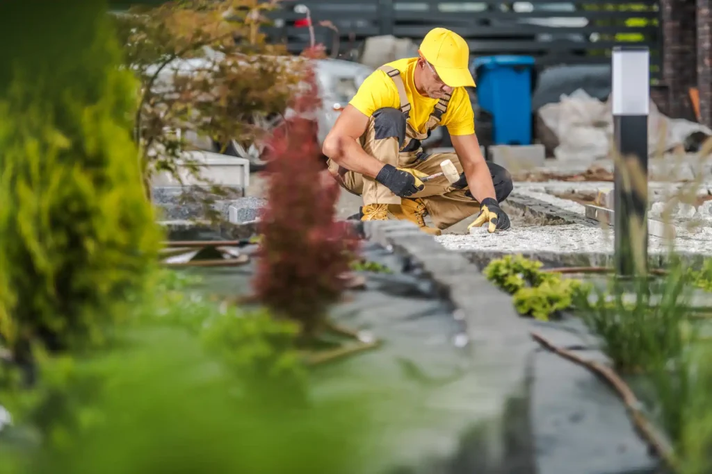 landscaper working in garden providing landscaping services in dubai